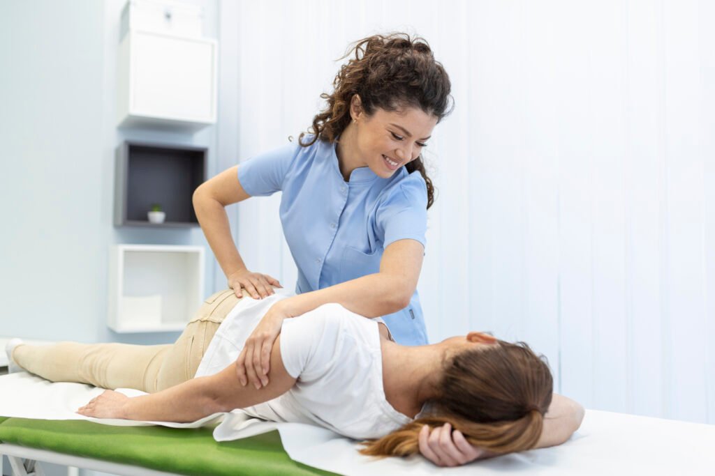 Young Women doctor chiropractor fixing lying womans back with hands movements